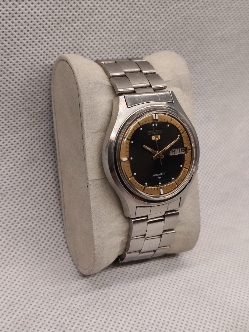 Seiko 5 Automatic watch 7009-8020 (Category: Men's Watches) located in Pasig City. Submitted by timepiece-and-co (Listing ID 1468401813, Image 3). Description: This is a vintage Seiko 5 Automatic watch. The specific reference and caliber number for this model variation (featuring the distinctive black center dial with a gold/tan outer ring) is the Seiko 7009-8020 (often also cataloged under related casing references like 7009-8023 or 7009-8028). 