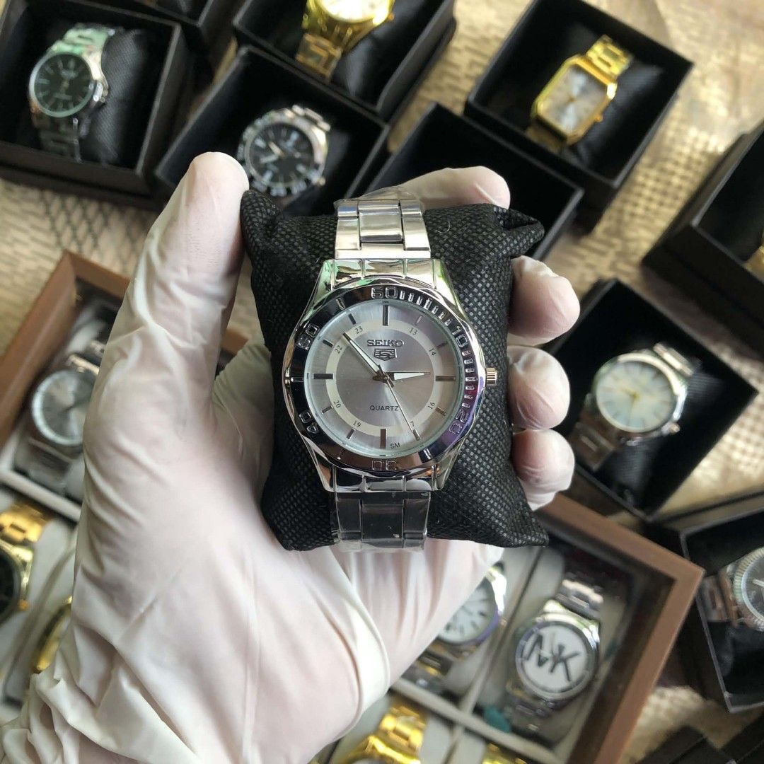 Seiko 5 Quartz Silver Steel Watch (Category: Men's Watches) located in Lucena. Submitted by jolo0419 (Listing ID 1468285358, Image 1). Description: - Brand: Seiko 5 - Movement: Quartz - Dial: Grey with silver hands and hour markers - Bezel: Rotatable - Bracelet: Stainless steel link bracelet (still with protective plastic) - Condition: Brand new with black display box and pillow included.