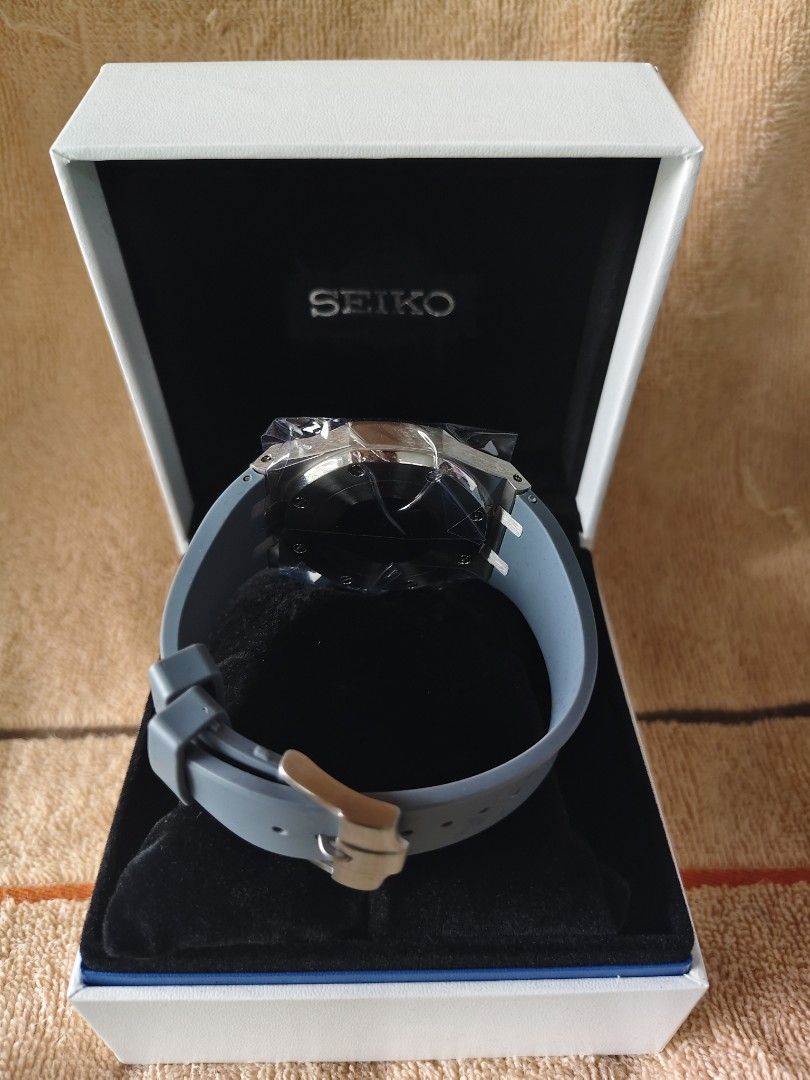 Seiko Chronograph Quartz Watch with Grey Rubber Strap MOD (Category: Men's Watches) located in Manila. Submitted by rarewind.cb1244 (Listing ID 1468316020, Image 2). Description: - Brand: Seiko - Condition: Brand new, never worn, with protective plastic still attached - Dial: Silver-tone textured dial with contrasting black subdials - Bezel: Distinctive octagonal bezel with exposed screws - Strap: Comfortable grey silicone/rubber strap with pin b