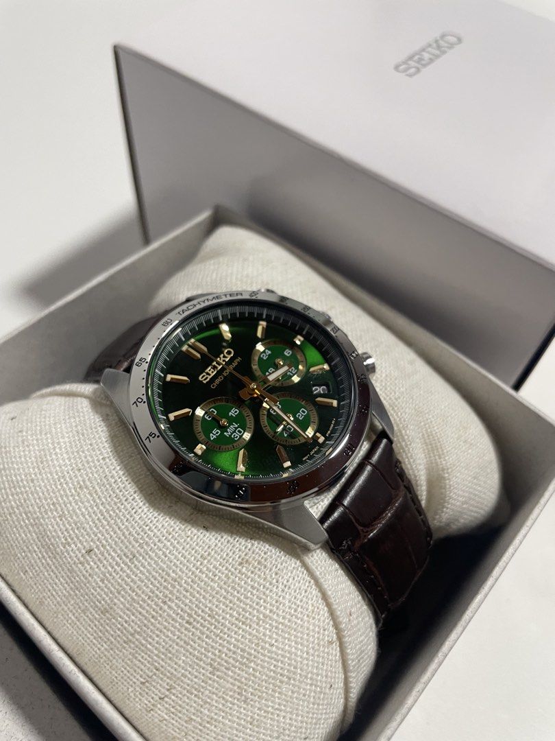 Seiko Chronograph SBTR017 “Money Green” (Category: Men's Watches) located in Manila. Submitted by kennethv (Listing ID 1468401377, Image 3). Description: - Model: Seiko Chronograph Watch - Dial: Deep green with elegant gold indices and hands - Case: Silver-tone stainless steel with a practical date window at the 4 o'clock position - Functions: Fully functional chronograph sub-dials - Strap: Dark brown leather with stylish crocodile embossing - In