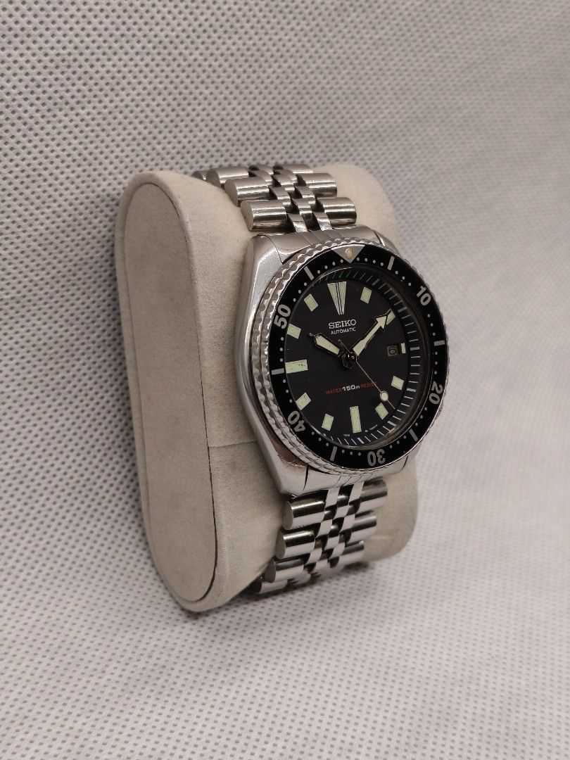 Seiko Diver 150m Automatic reference 7002-7000 (Category: Men's Watches) located in Pasig City. Submitted by timepiece-and-co (Listing ID 1468395531, Image 2). Description: Key Identification Features: Dial Details: It features a clean, date-only complication at the 3 o'clock position (dropping the day display of earlier models) and distinct rectangular/trapezoidal hour markers. Dial Text: Branded with "SEIKO AUTOMATIC" below 12 o'clock and the i