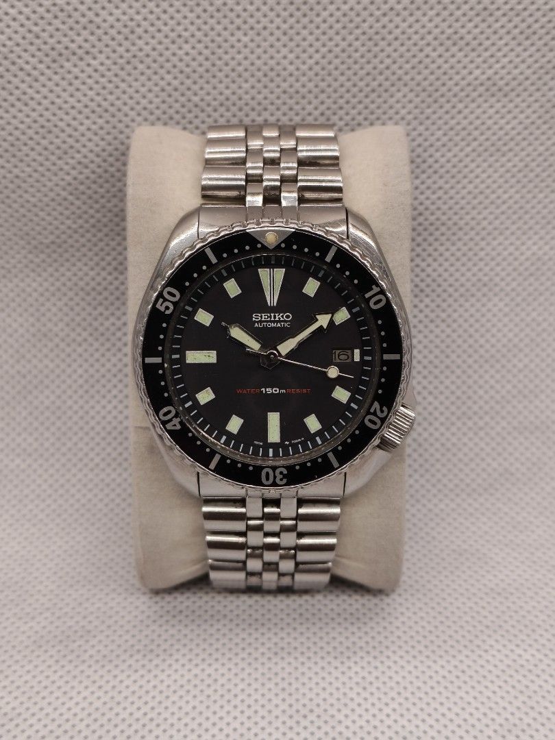 Seiko Diver 150m Automatic reference 7002-7000 (Category: Men's Watches) located in Pasig City. Submitted by timepiece-and-co (Listing ID 1468395531, Image 1). Description: Key Identification Features: Dial Details: It features a clean, date-only complication at the 3 o'clock position (dropping the day display of earlier models) and distinct rectangular/trapezoidal hour markers. Dial Text: Branded with "SEIKO AUTOMATIC" below 12 o'clock and the i