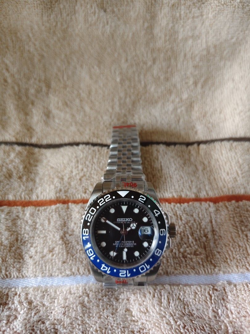 Seiko GMT Master II Mod Watch Batman Bezel MOD (Category: Men's Watches) located in Manila. Submitted by rarewind.cb1244 (Listing ID 1468316478, Image 1). Description: - Custom Seiko Mod Watch with Batman Blue/Black GMT Bezel - Sleek black dial with 3 o'clock date window and Cyclops lens - Reliable automatic movement with screw-down crown and solid case back - Stainless steel Jubilee-style bracelet (still wrapped in factory protective plastics wi