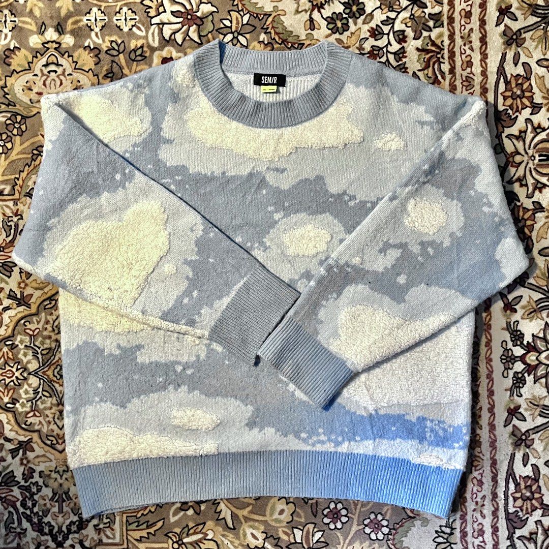 SEM/R CLOUD WOOL SWEATER (Category: Coats, Jackets and Outerwear) located in Manila. Submitted by thrft777 (Listing ID 1468336760, Image 2). Description: ❗️READ THE FOLLOWING BEFORE INQUIRING❗️ Dimes: H: 25inch W: 24inch Details: Boxy Oversized | Baby blue color | Embossed cloud designs. Size reference (In the last two photos): 1st photo: Woman | 5’1 | 49KG. 2nd photo: Man | 5’8 | 65KG Issue: NONE 100% Like brand new NON NEGOTIABLE: PAYMENT FIRST