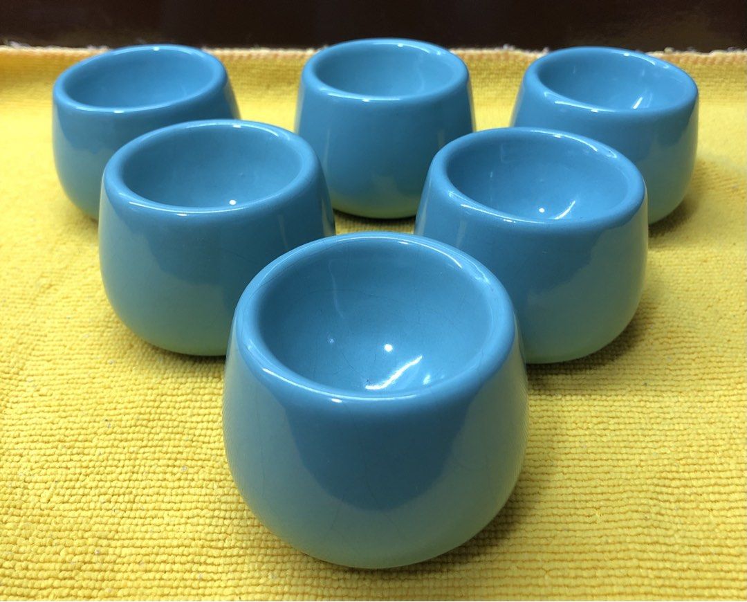 Egg Cup Holders (blue) (Category: Dinnerware & Cutlery) located in Quezon City. Submitted by may.reyes (Listing ID 1468297304, Image 1). Description: - Set of 6 round ceramic egg cups - Lovely light blue glaze with a smooth, glossy finish - Securely holds soft-boiled eggs for breakfast - Clean and ready for use - Features minor crazing lines from age and use.