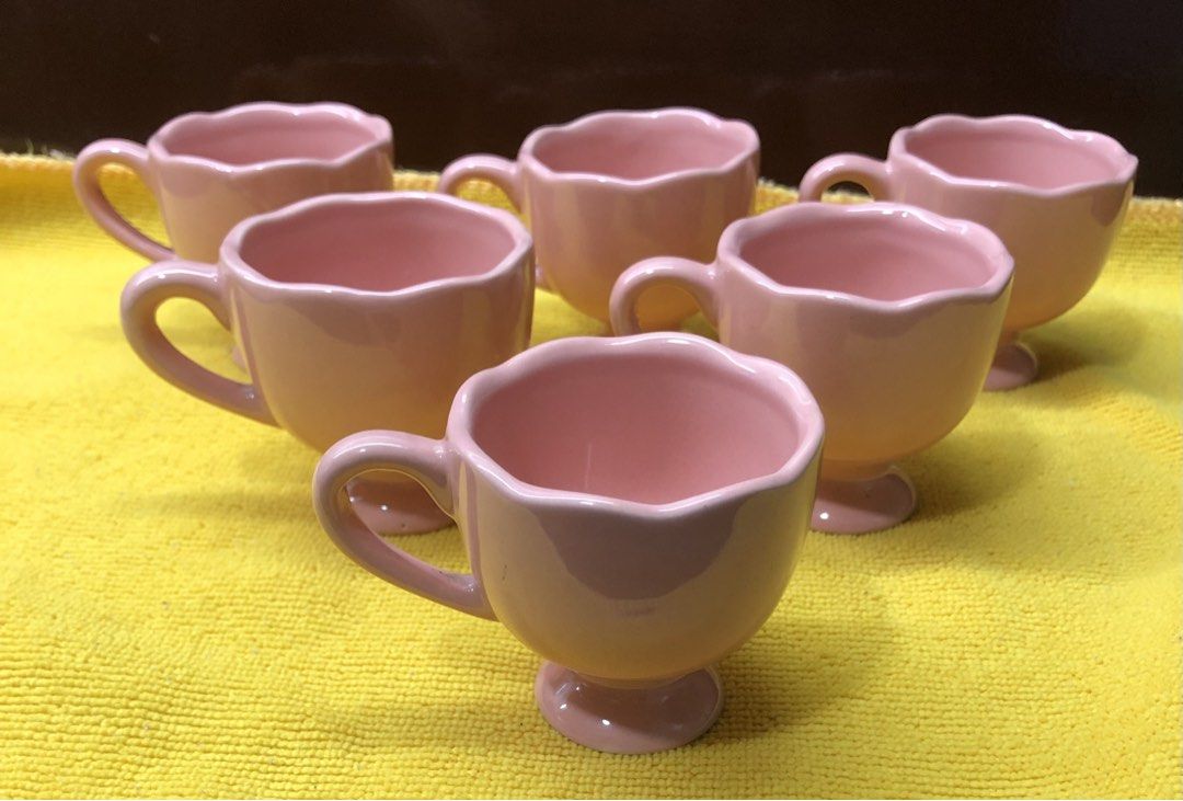 Egg Cup Holders (pink) (Category: Coffee & Tea Tableware) located in Quezon City. Submitted by may.reyes (Listing ID 1468297169, Image 1). Description: - Set of 6 matching pink ceramic cups - Features elegant pedestal bases and scalloped rims - Beautiful glossy finish all around - Versatile for coffee, tea, or small desserts.