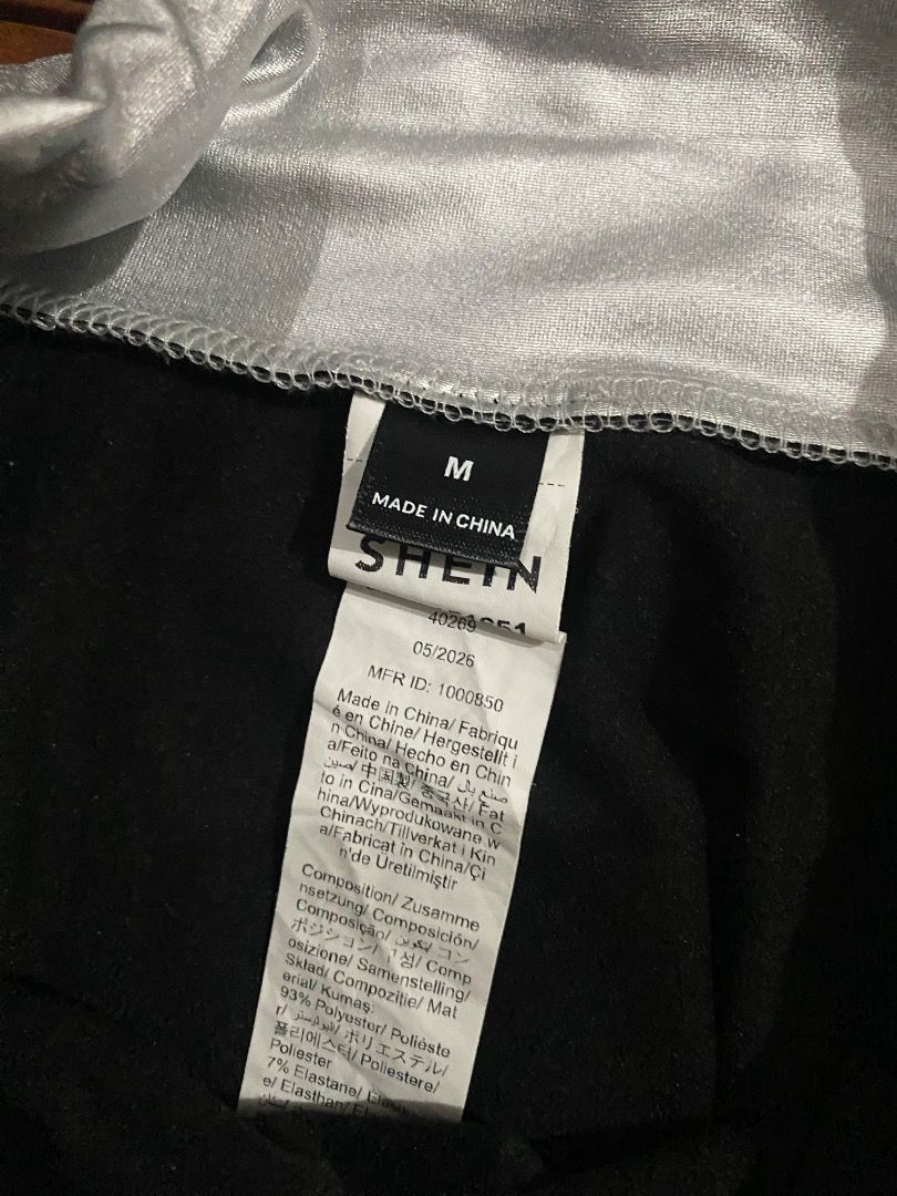SHEIN Silver Metallic Ruffle Skirt Size M (Category: Skirts) located in Pateros City. Submitted by strawberhyun (Listing ID 1468374066, Image 2). Description: - Brand: SHEIN - Size: Medium (M) - Color/Finish: Silver metallic with a shiny finish - Design: Layered ruffle skirt with eyelet waistband and side tie strings - Lining: Comfortable black lining underneath - Material: 93% polyester, 7% elastane - Perfect for: Parties, night outs, and statem