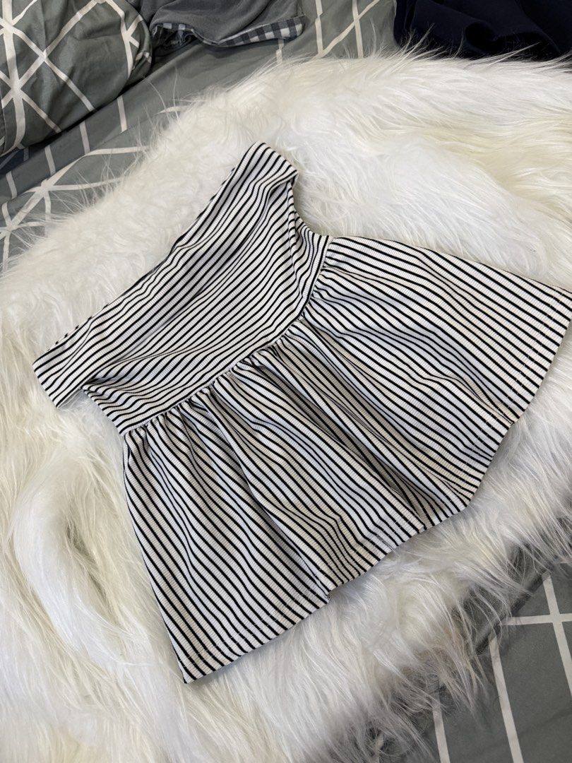 Shein Tube Top (Category: Dresses) located in Las Pinas. Submitted by juls_mp (Listing ID 1468399579, Image 1). Description: - Style: Black and white striped off-shoulder dress - Fit: Fitted bodice with a flared, pleated hem - Fabric: Ribbed texture throughout - Length: Short - Condition: Clean and ready to wear.