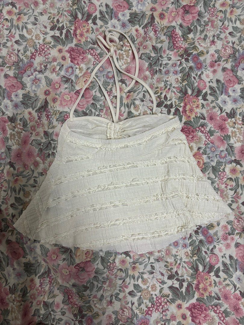 Shein White Lace Halter Top Size XS (Category: Sleeveless) located in Manila. Submitted by urthrifthany (Listing ID 1468443526, Image 2). Description: - Brand: Shein - Condition: like new with tags attached (BNWT) - Size: XS / EU 34 / US 2 - Color: White - Style: Halter top with tie-neck and back straps - Details: Chic lace trim and textured flowy fabric - Perfect for: Casual wear, dates, or vacations.