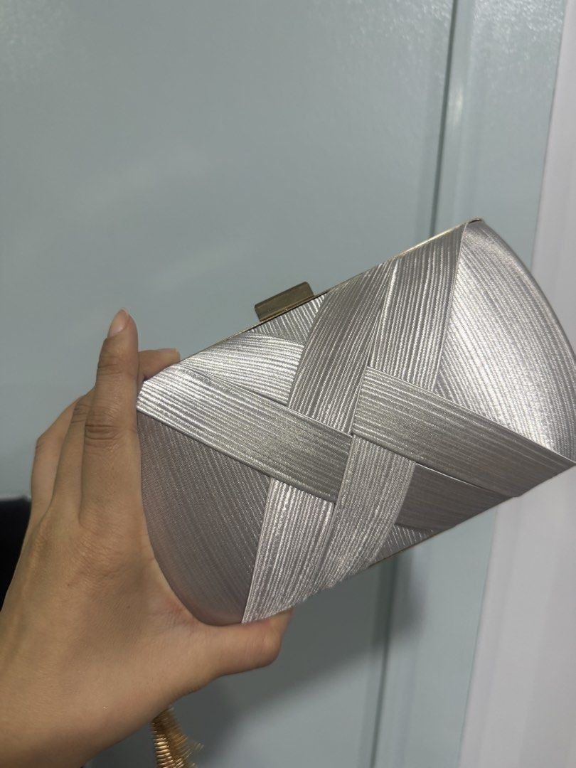 Silver clutch (Category: Clutches) located in Quezon City. Submitted by destashingmycloset (Listing ID 1468334623, Image 1). Description: .
