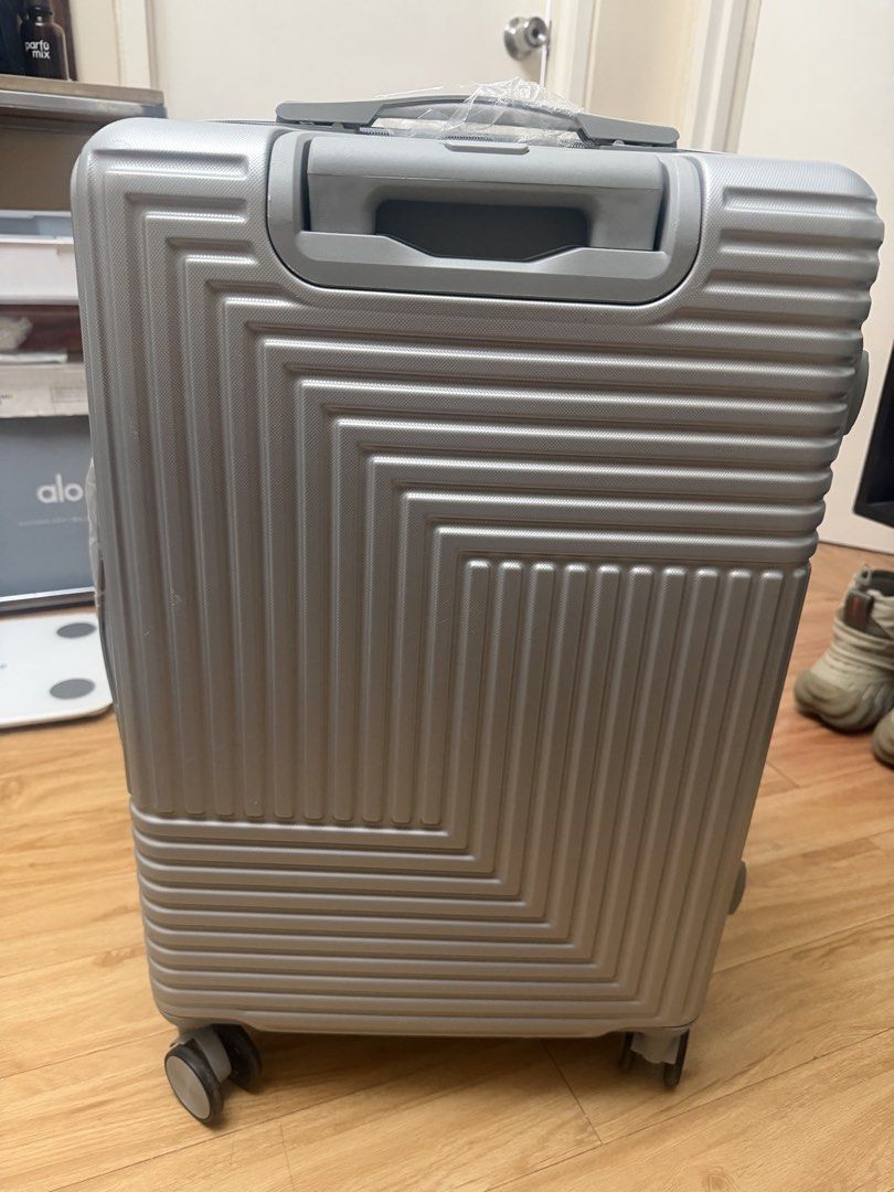Silver Hardside Luggage Spinner Suitcase (Category: Luggage) located in Manila. Submitted by mrjalandoni (Listing ID 1468470628, Image 2). Description: - Color/Design: Silver hardside with a trendy geometric ribbed pattern - Mobility: Smooth 360-degree spinner wheels for effortless travel - Security: Built-in side combination lock for added safety - Handling: Sturdy top and side carry handles - Interior: Clean black fabric lining with zero stains
