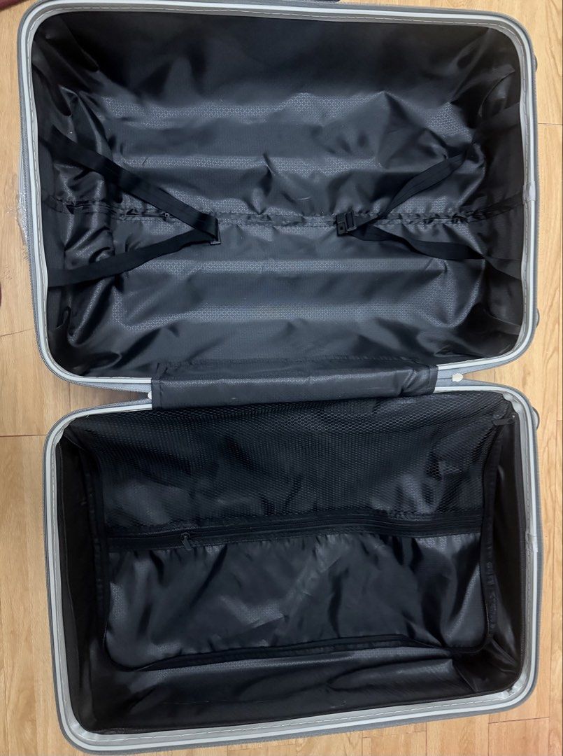 Silver Hardside Luggage Spinner Suitcase (Category: Luggage) located in Manila. Submitted by mrjalandoni (Listing ID 1468470628, Image 3). Description: - Color/Design: Silver hardside with a trendy geometric ribbed pattern - Mobility: Smooth 360-degree spinner wheels for effortless travel - Security: Built-in side combination lock for added safety - Handling: Sturdy top and side carry handles - Interior: Clean black fabric lining with zero stains