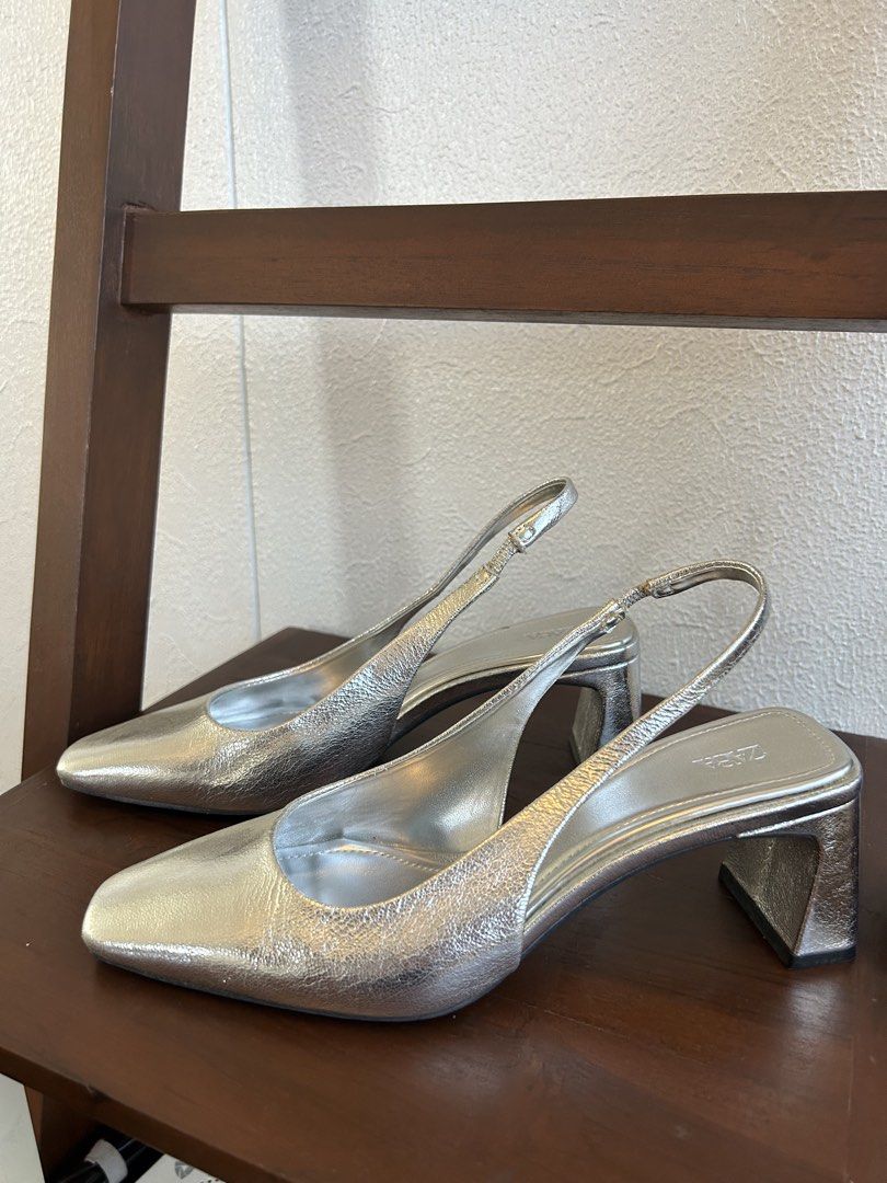 Silver slingback heels (Category: Heels) located in Quezon City. Submitted by patvluspo (Listing ID 1468347409, Image 2). Description: It’s simple and elegant. Easy to match any outfit. Reason for selling: quite uncomfortable for my feet. .