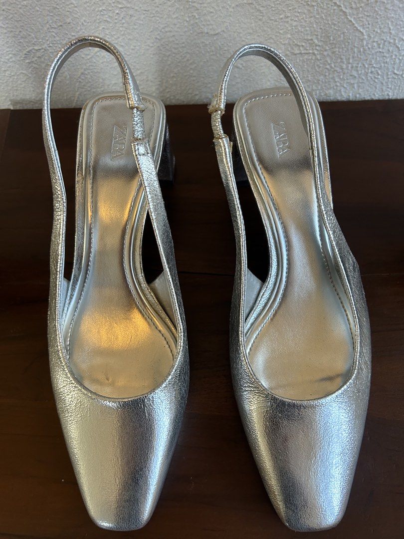 Silver slingback heels (Category: Heels) located in Quezon City. Submitted by patvluspo (Listing ID 1468347409, Image 1). Description: It’s simple and elegant. Easy to match any outfit. Reason for selling: quite uncomfortable for my feet. .