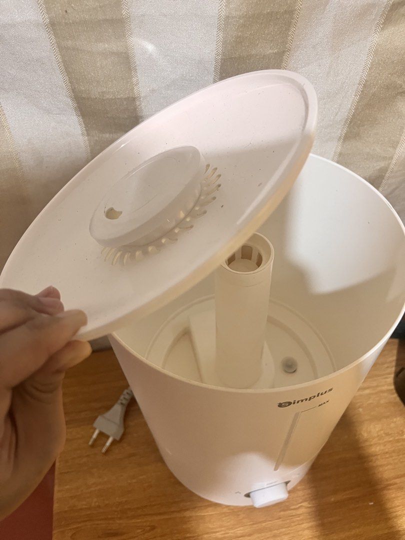 Simplus Humidifier Model JASH002 White (Category: Air Purifiers & Dehumidifiers) located in Marikina City. Submitted by ceduey (Listing ID 1468442084, Image 2). Description: - Brand: Simplus Ultrasonic Humidifier - Model: JASH002 (White) - Adjustable mist control knob & clear water level window with max line - Removable top lid for hassle-free refilling - Power: 23W, 220-240V (Standard two-pin plug) - Dimensions: 18.7 x 18.7 x 30 cm (Compact size