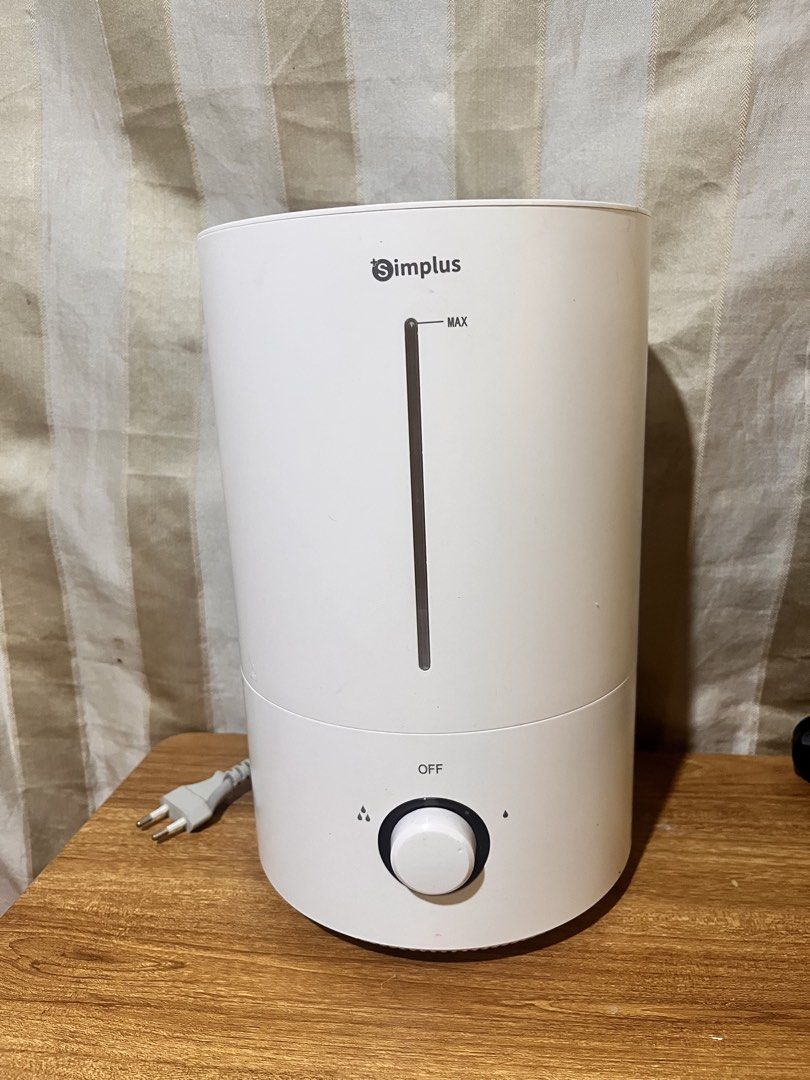 Simplus Humidifier Model JASH002 White (Category: Air Purifiers & Dehumidifiers) located in Marikina City. Submitted by ceduey (Listing ID 1468442084, Image 1). Description: - Brand: Simplus Ultrasonic Humidifier - Model: JASH002 (White) - Adjustable mist control knob & clear water level window with max line - Removable top lid for hassle-free refilling - Power: 23W, 220-240V (Standard two-pin plug) - Dimensions: 18.7 x 18.7 x 30 cm (Compact size