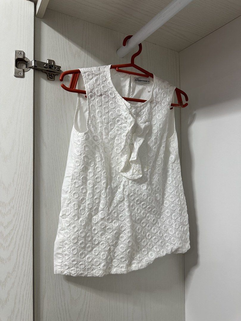 Size 14 Peppermint White Eyelet Sleeveless Ruffle Blouse (Category: Sleeveless) located in Quezon City. Submitted by sunkissed.ph (Listing ID 1468292028, Image 1). Description: size 14 w/ small stain ₱250.