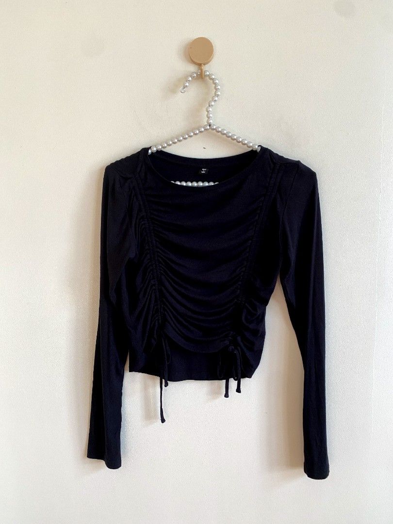 Small GU Ruthing Shirt (Category: Others Tops) located in Castillejos. Submitted by lalainecloset22 (Listing ID 1468362425, Image 3). Description: - Brand: GU - Size: Small (S) - Color: Black - Material: 93% Rayon, 7% Spandex (soft, breathable, and stretchable) - Features: Long sleeves, front ruching design with adjustable drawstrings - Condition: Excellent / Like new - Perfect for daily casual wear, styling with high-waist jeans or skirts.