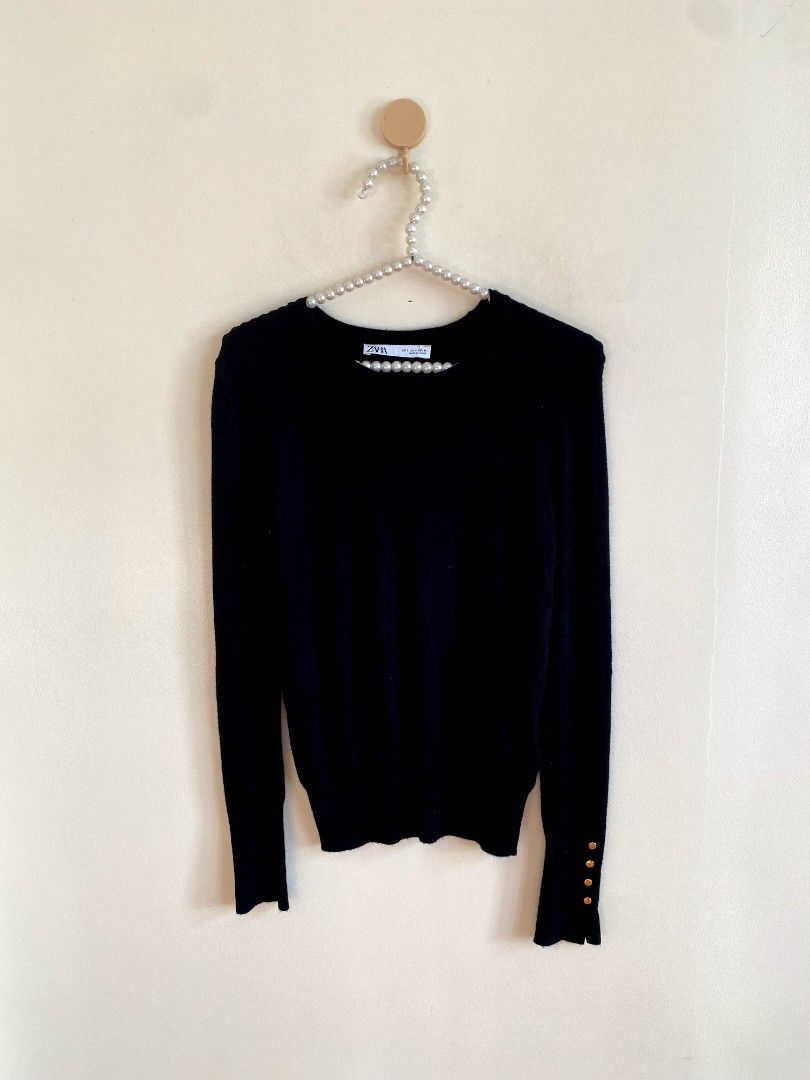 Small Zara Knit Sweater with Gold Details (Category: Others Tops) located in Castillejos. Submitted by lalainecloset22 (Listing ID 1468362721, Image 2). Description: - Brand: Zara - Size: Small (EUR S / USA S) - Color: Classic Black - Material: Comfortable knit fabric - Features: Elegant gold-tone button details on sleeve cuffs - Condition: Excellent, well-maintained.