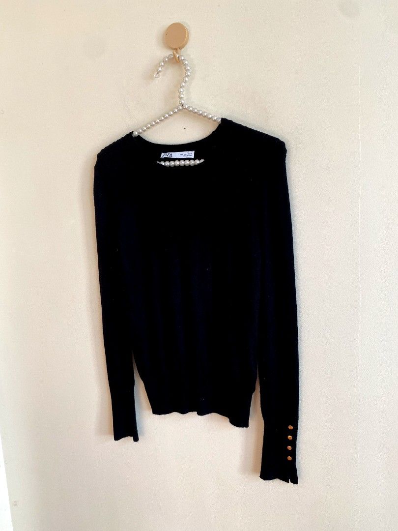 Small Zara Knit Sweater with Gold Details (Category: Others Tops) located in Castillejos. Submitted by lalainecloset22 (Listing ID 1468362721, Image 3). Description: - Brand: Zara - Size: Small (EUR S / USA S) - Color: Classic Black - Material: Comfortable knit fabric - Features: Elegant gold-tone button details on sleeve cuffs - Condition: Excellent, well-maintained.