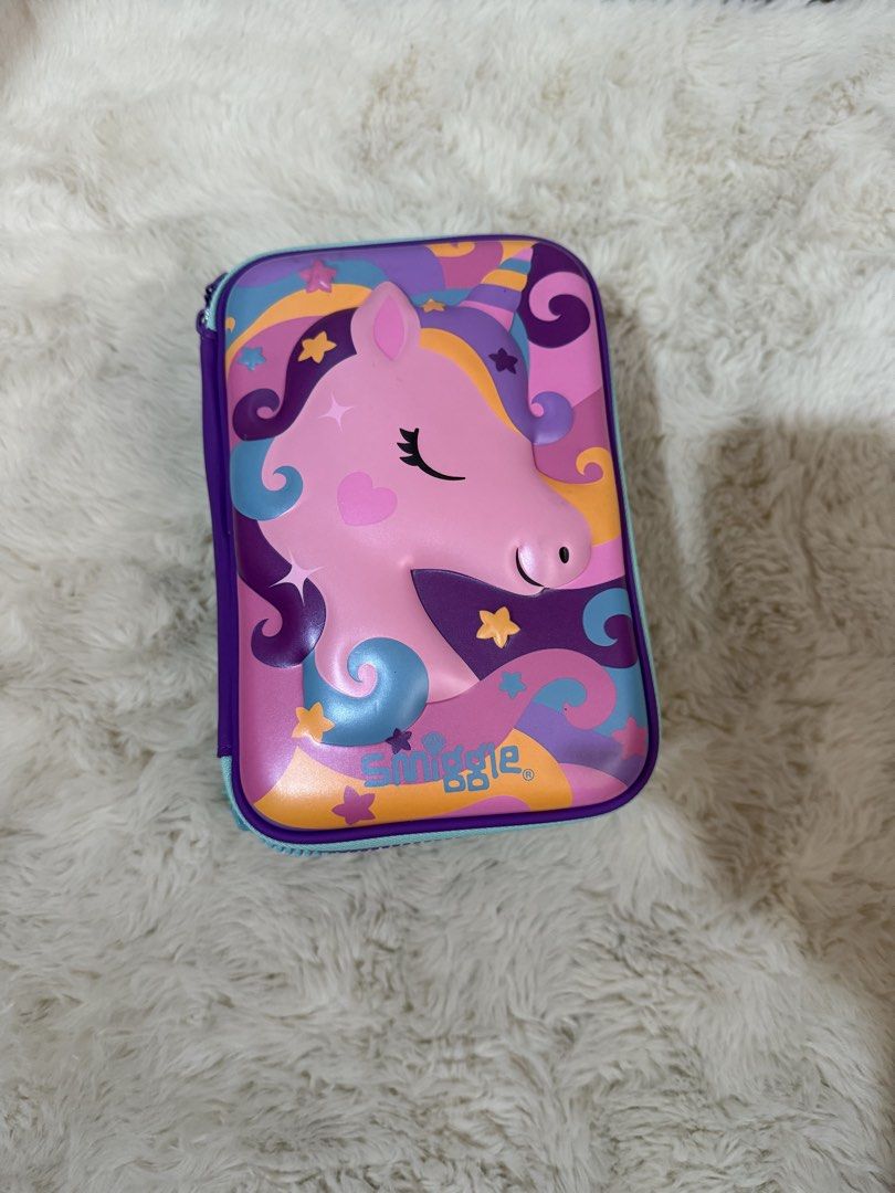 Smiggle Unicorn and Sweets Hardtop Pencil Case Set (Category: Stationery & School Supplies) located in Manila. Submitted by btsalbumssssss (Listing ID 1468448923, Image 2). Description: - Authentic Smiggle pencil case bundle (Set of 2) - Design 1: Pink unicorn with star-filled background - Design 2: Holographic silver with embossed sweets, donuts, and ice cream - Full zip-around closure for easy access - Interior includes mesh pockets and elastic