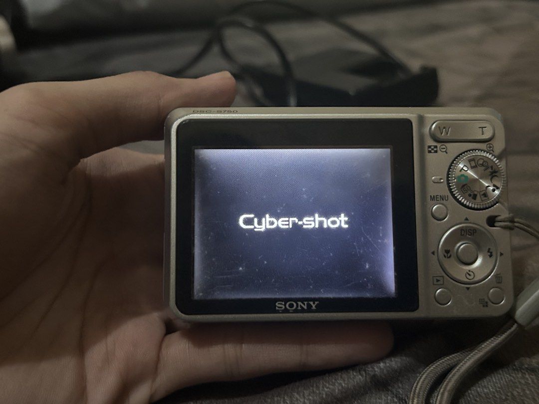 Sony Cyber-shot DSC-S750 7.2MP Digital Camera (Category: Cameras) located in Pandi. Submitted by demmyyy (Listing ID 1468461851, Image 2). Description: No any functional issues but have cosmetic flaws. Tested & fully functional (lens, flash, buttons, zoom, photo capture all working) COSMETIC FLAWS: (u can refer naman sa mga pic sa taas) - Body Scratches - Broken battery lock but yung battery door still intact - Screen degradation (dusty & slightl