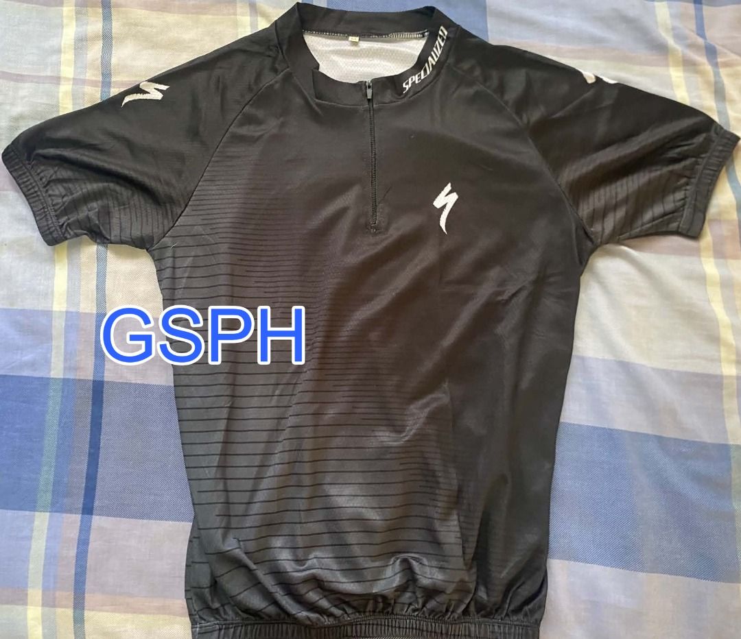 Specialized Black Cycling Jersey Short Sleeve Size S (Category: Activewear) located in Makati City. Submitted by goodiesstuff_ph_17119811 (Listing ID 1468435677, Image 1). Description: - Color: Sleek black with white branding on the collar and chest - Design: Short sleeve, half zip front closure, and textured striped pattern - Storage: Traditional 3-pocket setup on the lower back - Fit: Elastic hem to keep the jersey secure while riding - Measure
