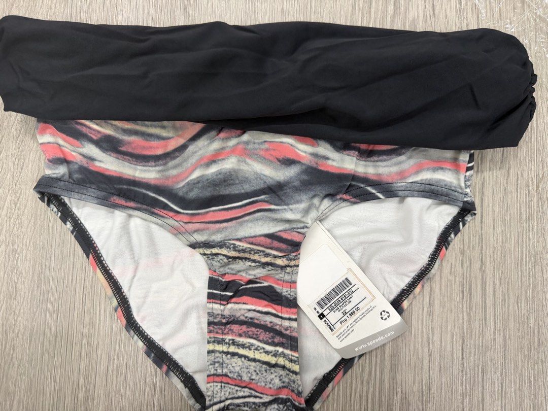Speedo Dune Shaper Pant Bikini Bottom Size 32 Multicolor (Category: Bikinis & Swimsuits) located in Pasig City. Submitted by jeymi88 (Listing ID 1468409256, Image 1). Description: - Brand: Speedo Dune Shaper Pant - Size: 32 inches - Design: Abstract wave pattern in black, pink, grey, and yellow with a solid black folded waist detail - Condition: Brand new, unworn, with original hangtag attached (PHP pricing shown) - Perfect for swimming or beach 