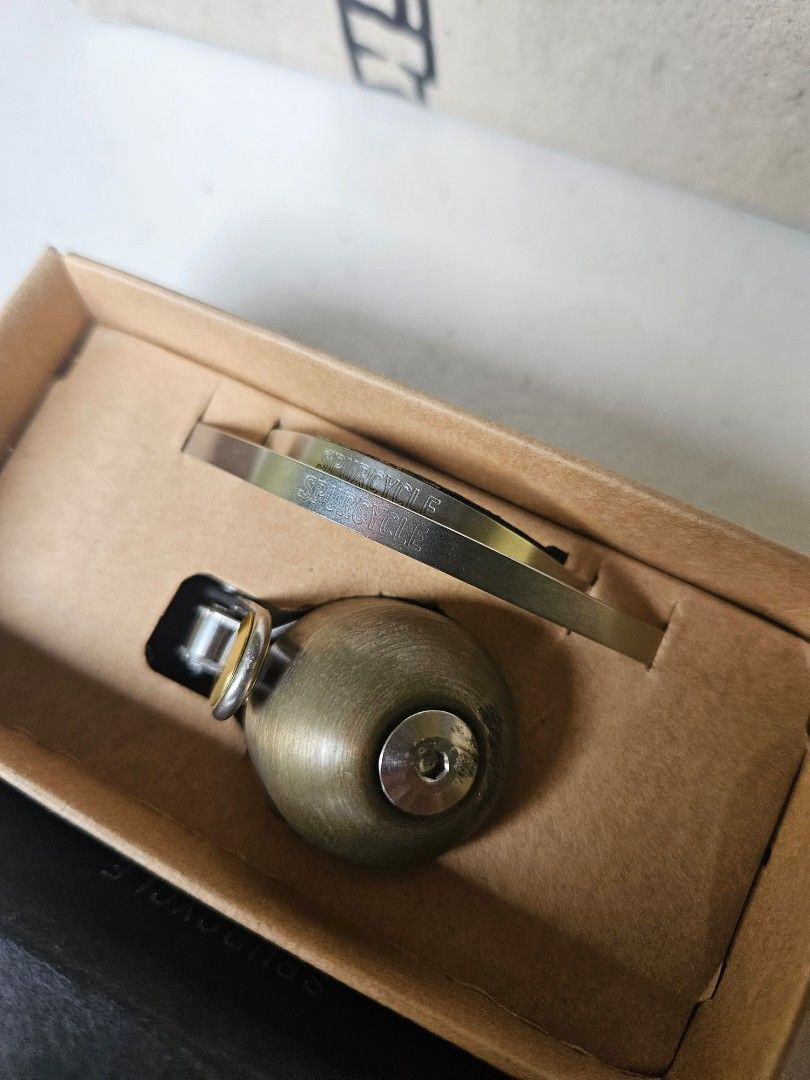 Spurcycle Bell (Category: Bicycles) located in Quezon City. Submitted by fliptongz (Listing ID 1468315370, Image 2). Description: Authentic Spurcycle Original Bicycle Bell (Silver / Raw / Gold Accents) for sale. Complete with original mounting metal bands (fits 22.2mm and 31.8mm handlebars). - Used condition. Shows visible signs of use, including scratches and scuffs around the top bolt/dome area as seen in the photos. - 100% fully functional. Th