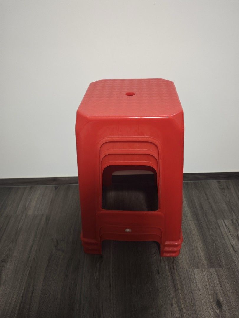 Stackable red plastic stools set (Category: Chairs) located in Singapore. Submitted by pearllzy (Listing ID 1468365073, Image 1). Description: - Set of 3 bright red stackable stools - Space-saving design that easily tucks away - Durable, low-maintenance material that is easy to wipe clean - Ideal for balcony or extra home seating - $6 for all 3 Collection at my place.