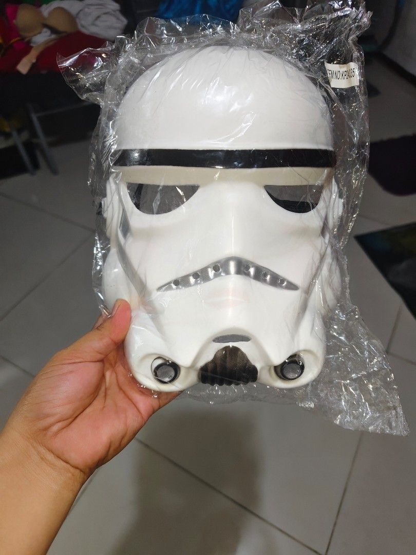 Star Wars Costume, with Mask, Stormtrooper Costume Jumpsuit (Category: Kids Wardrobes & Storage) located in Manila. Submitted by duffy-080 (Listing ID 1467406196, Image 2). Description: - Official Star Wars Stormtrooper costume jumpsuit - Size M (tag attached) - Classic white and black printed armor details on front and back - Includes long sleeves and built-in shoe covers - Made in China (Warning: Keep away from fire) -Bust 38cm for kids -waist 