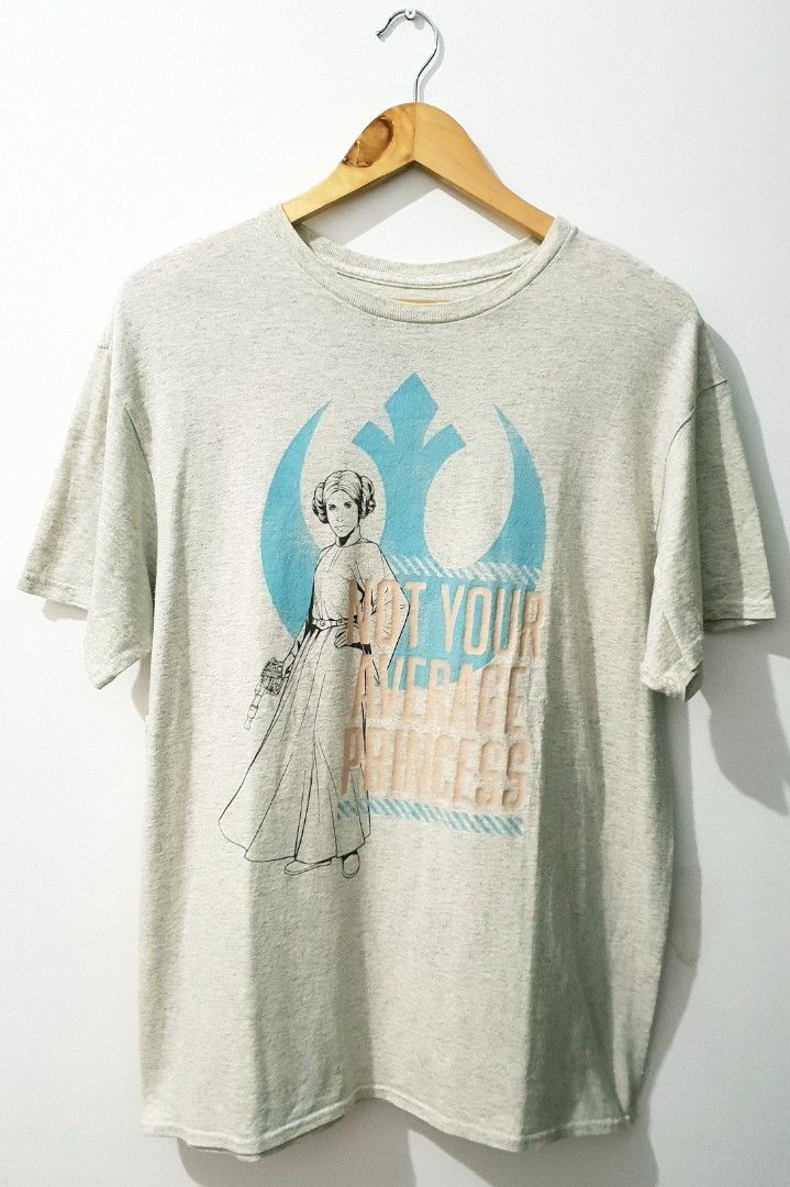 Star Wars Princess Leia (Not Your Average Princess) (Category: Shirts) located in Taguig. Submitted by wethrifting2021 (Listing ID 1468417982, Image 1). Description: Item: Princess Leia🔥 Size: OPT Starwars (L) Width: 22 Length: 28.5 Condition: Excellent Issue: Hairline, Pinhole on hem SWIPE MORE DETAILS. DM to purchase 📩.