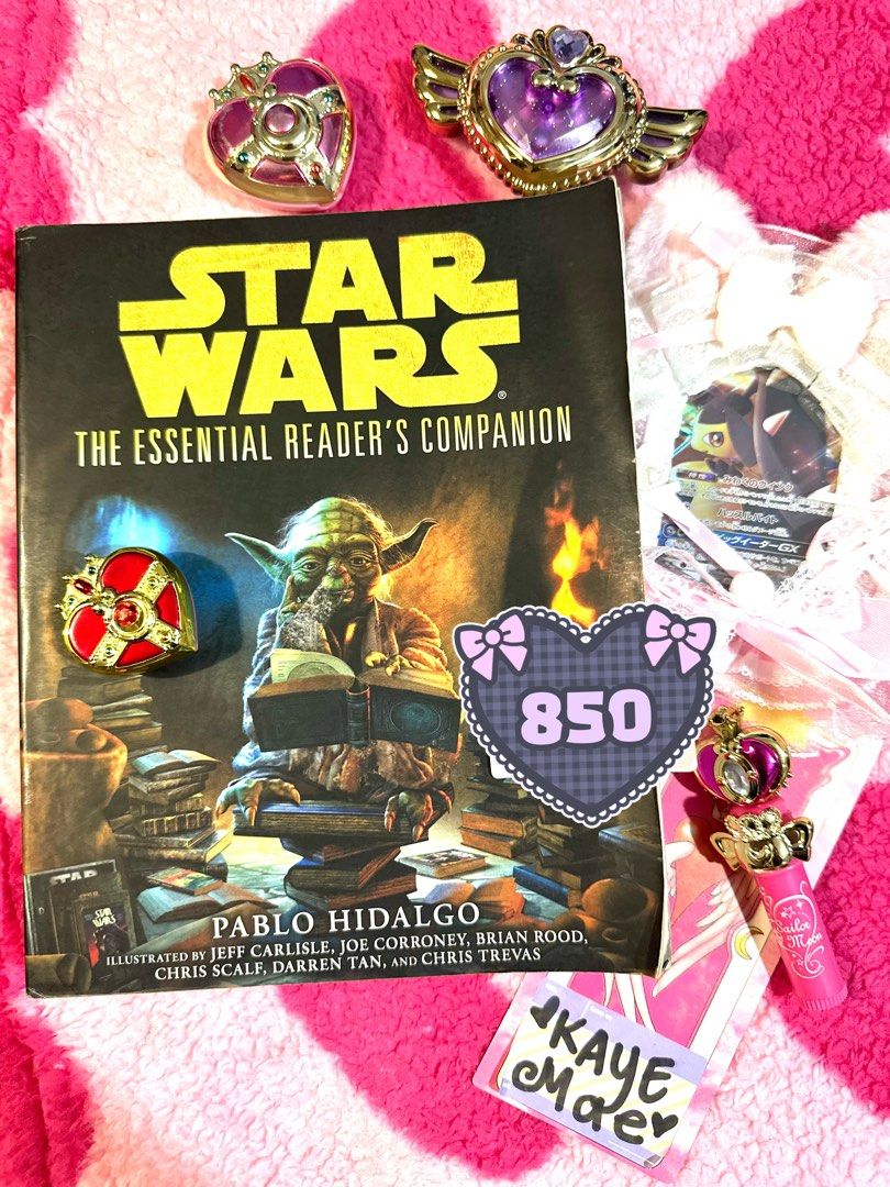 Star Wars The Essential Reader's Companion by Pablo Hidalgo (Category: Storybooks) located in Adams. Submitted by precurekaei (Listing ID 1468362636, Image 1). Description: - Title: Star Wars The Essential Reader's Companion - Author: Pablo Hidalgo (with contributions by Jeff Carlisle, Joe Corroney, Brian Rood, Chris Scalf, Darren Tan, and Chris Trevas) - Format: Paperback - Cover Art: Yoda reading surrounded by stacks of books - Condition: Pages