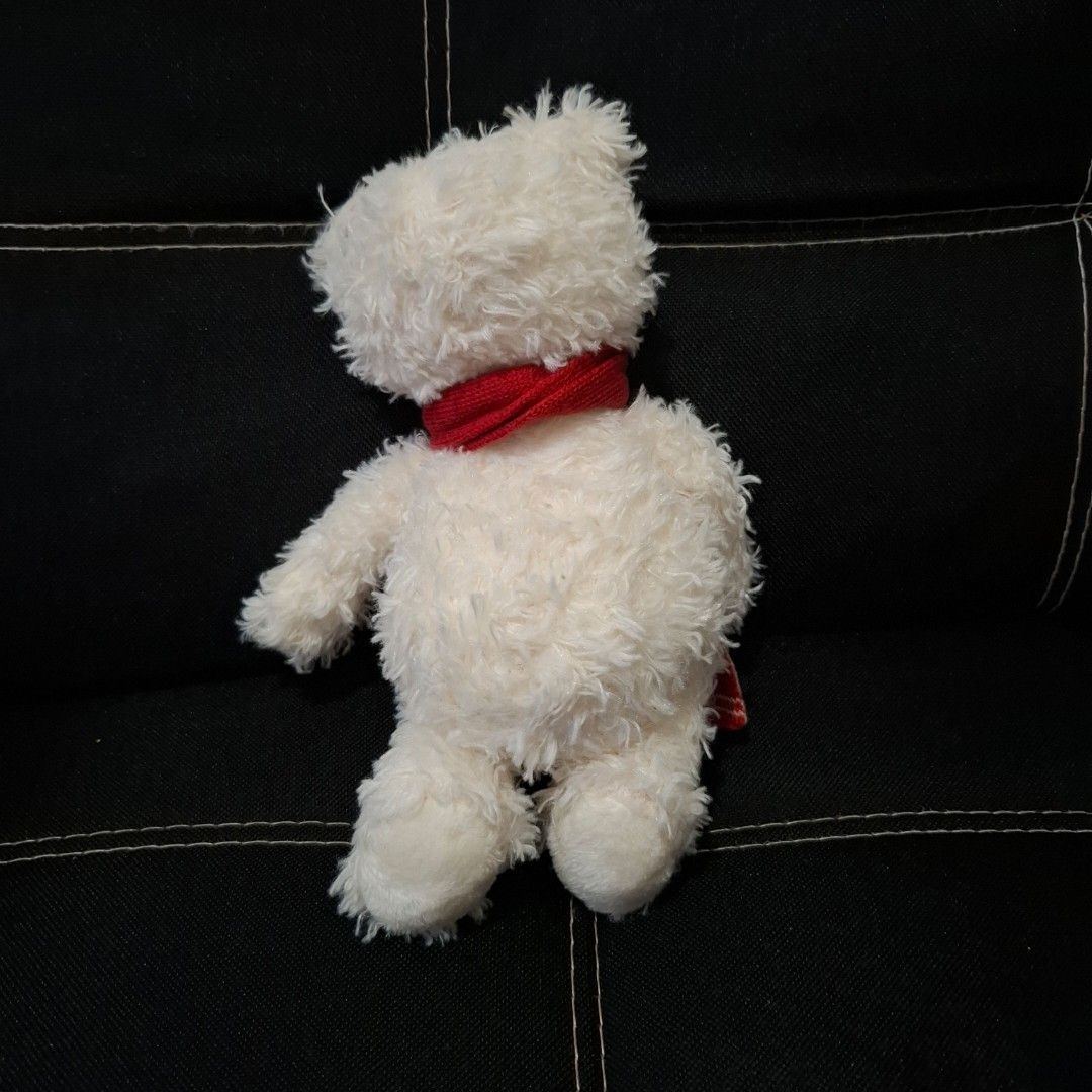 Steiff Original Charly Teddy Bear with Red Scarf (Category: Plushies & Soft Toys) located in Baliuag. Submitted by ahgashop. (Listing ID 1468295148, Image 3). Description: - Authentic Steiff Original Charly plush bear - Super soft and fluffy white fur - Includes classic paper chest tag and yellow ear tag - Wears a festive red knit scarf with a white snowflake pattern - Perfect gift for collectors and kids alike.