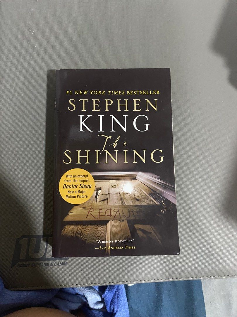 Stephen King The Shining Novel Paperback Book (Category: Storybooks) located in Manila. Submitted by pellucid000 (Listing ID 1468368091, Image 1). Description: - Title: The Shining by Stephen King - Format: Paperback with movie tie-in cover art - Special Feature: Includes an exclusive excerpt from Doctor Sleep - Perfect for: Horror fans and collectors - Fulfillment: Ready to ship or available for meet-up - Bought originally from fullybooked at 55