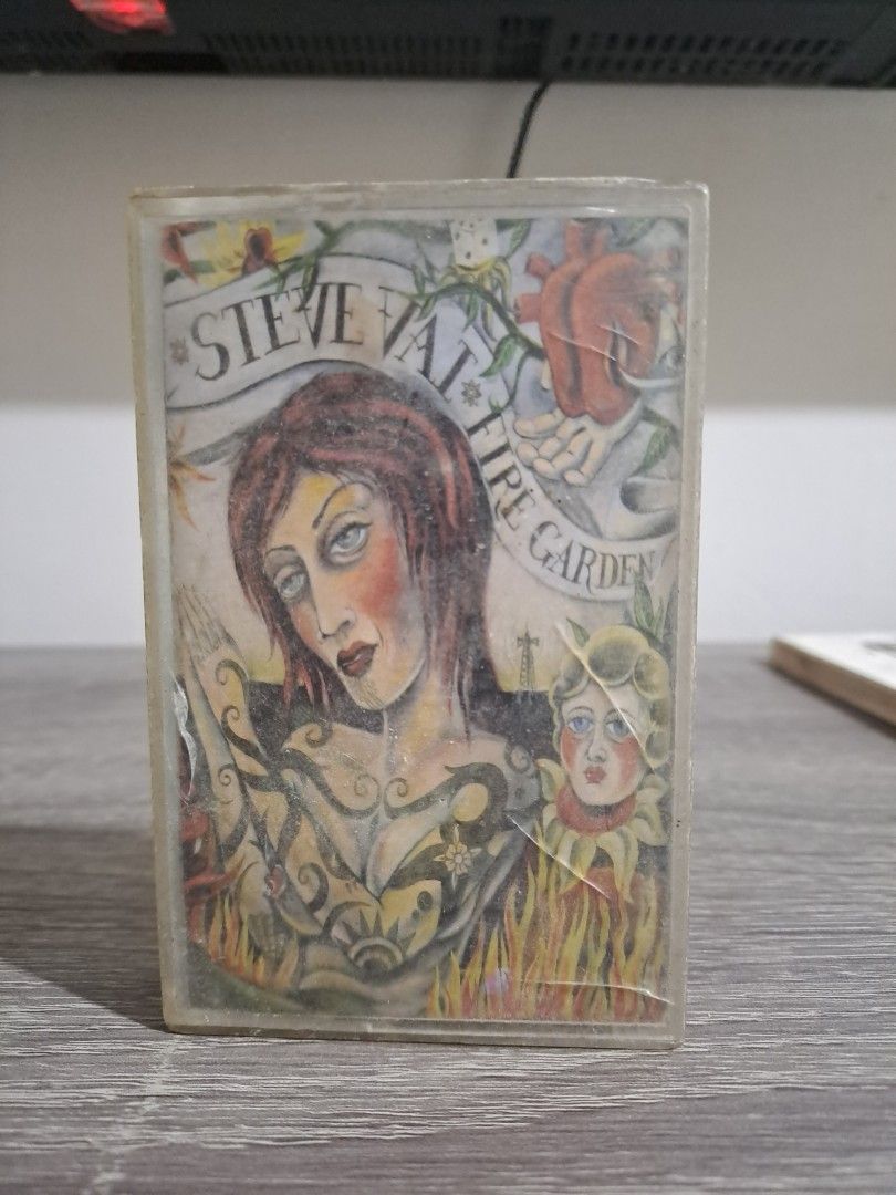 STEVE VAI Fire Garden Cassette Tape (Category: CDs & DVDs) located in Las Pinas. Submitted by cobieshop (Listing ID 1468478331, Image 1). Description: 📼CASSETTE FOR SALE | ORIGINAL & COLLECTIBLE CASSETTES 📼Item: [STEVE VAI Fire Garden Cassette Tape] 📌 Condition: [VG] 📦 Inclusions: [Cassete Case, Inlay] ✅ Actual item shown in photos ✅ Please check the photos and read the condition details before purchasing ✅ Secure packaging for shipping ✅ Mes