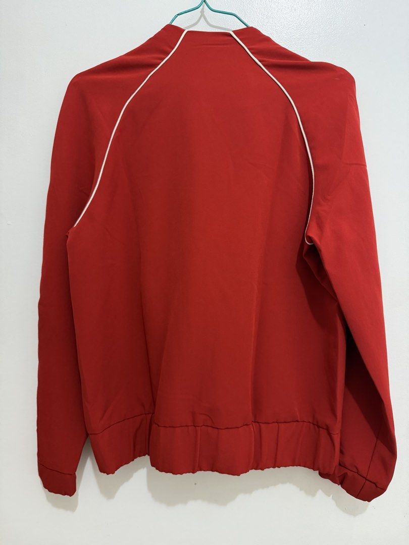 Stradivarius Red Jacket (Category: Coats, Jackets and Outerwear) located in Malolos. Submitted by eadiana (Listing ID 1468487398, Image 3). Description: - Brand: Stradivarius - Size: Small (Standard Fit) - Color: Bright red with white contrast piping - Features: Full white zipper, front pockets, ribbed hem and cuffs - Interior: Clean finish with bound seams - Style: Lightweight layering piece for casual outfits.