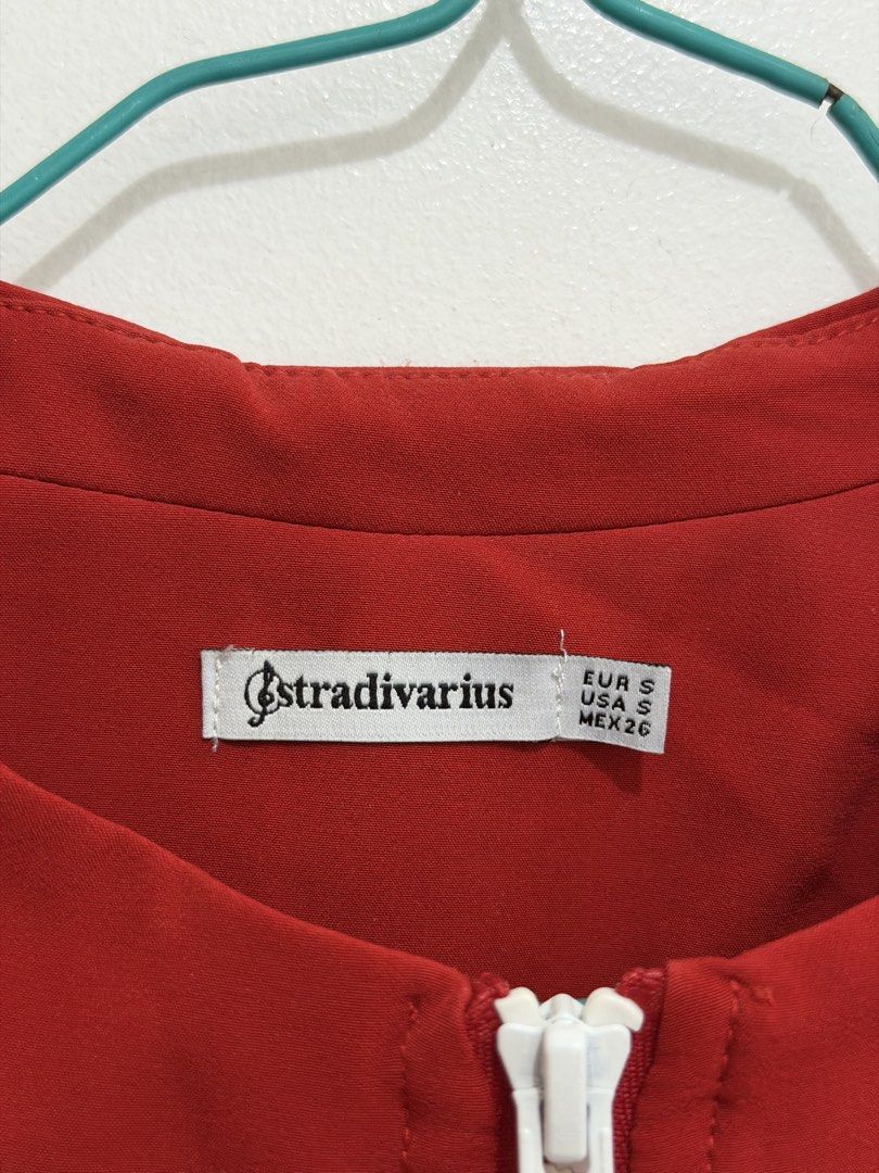 Stradivarius Red Jacket (Category: Coats, Jackets and Outerwear) located in Malolos. Submitted by eadiana (Listing ID 1468487398, Image 2). Description: - Brand: Stradivarius - Size: Small (Standard Fit) - Color: Bright red with white contrast piping - Features: Full white zipper, front pockets, ribbed hem and cuffs - Interior: Clean finish with bound seams - Style: Lightweight layering piece for casual outfits.