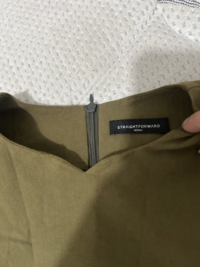 Straightforward Olive Green Medium Top (Category: Sleeveless) located in Las Pinas. Submitted by ladyattire (Listing ID 1468417347, Image 2). Description: - Brand: Straightforward - Color: Olive green - Size: Medium - Style: Sleeveless top with neckline zip detail - Measurements: ~17 inches chest (flat lay) - Condition: Clean fabric with good structure Fits up to Large.