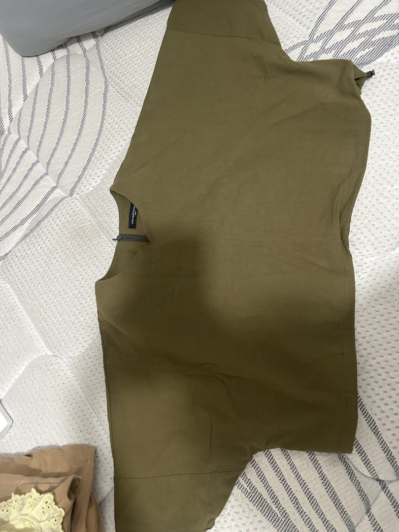 Straightforward Olive Green Medium Top (Category: Sleeveless) located in Las Pinas. Submitted by ladyattire (Listing ID 1468417347, Image 1). Description: - Brand: Straightforward - Color: Olive green - Size: Medium - Style: Sleeveless top with neckline zip detail - Measurements: ~17 inches chest (flat lay) - Condition: Clean fabric with good structure Fits up to Large.