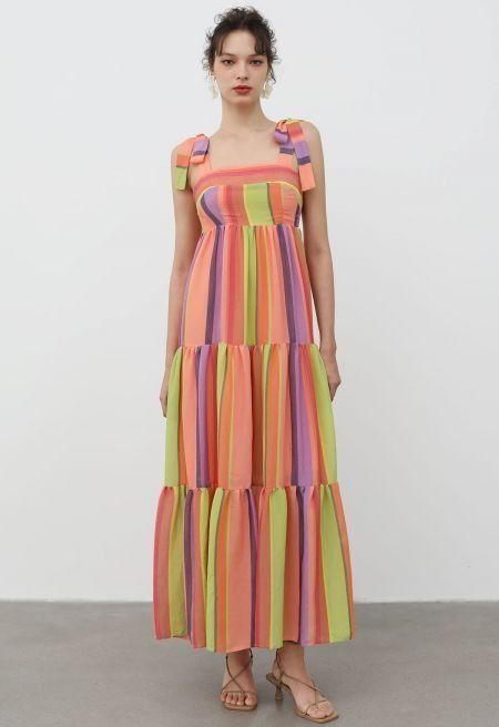 Stripe Tiered Maxi Dress (Category: Dresses) located in Manila. Submitted by erin_closet (Listing ID 1468308593, Image 1). Description: - Style: Multi-colored striped maxi dress with tiered skirt - Colors: Bright shades of orange, yellow, purple, and green - Details: Adjustable tie straps and comfortable smocked bodice - Size: XS - Condition: Like new, worn just a couple of times - Bought for 4K+.