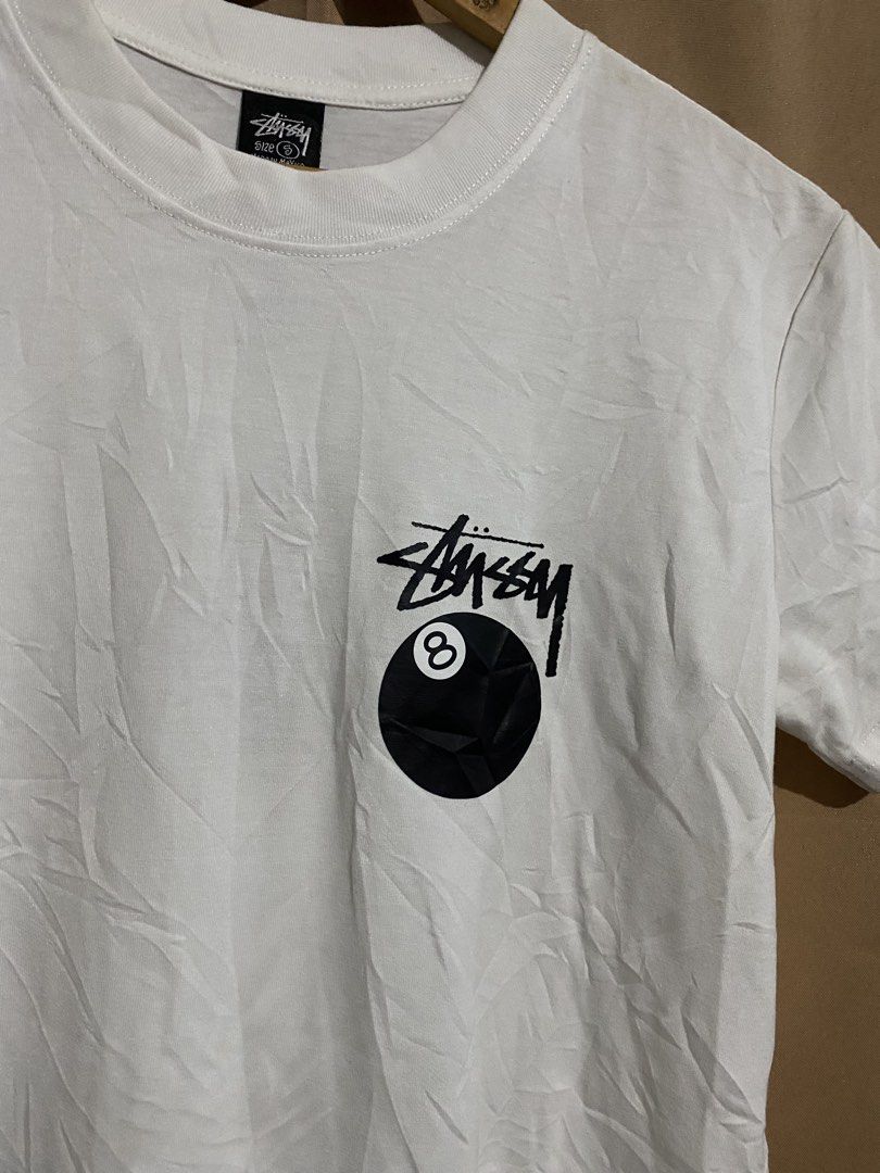 Stussy 8 Ball White Tee (Category: Tshirts & Polo Shirts ) located in Manila. Submitted by why_notph (Listing ID 1468420940, Image 2). Description: - Brand: Stussy - Item: Classic 8-ball graphic t-shirt - Color: White - Size: Small - Material: 100% cotton (Made in Mexico) - Condition: Clean fabric, solid streetwear staple - Care: Machine wash cold - Dimensions: 25x18.