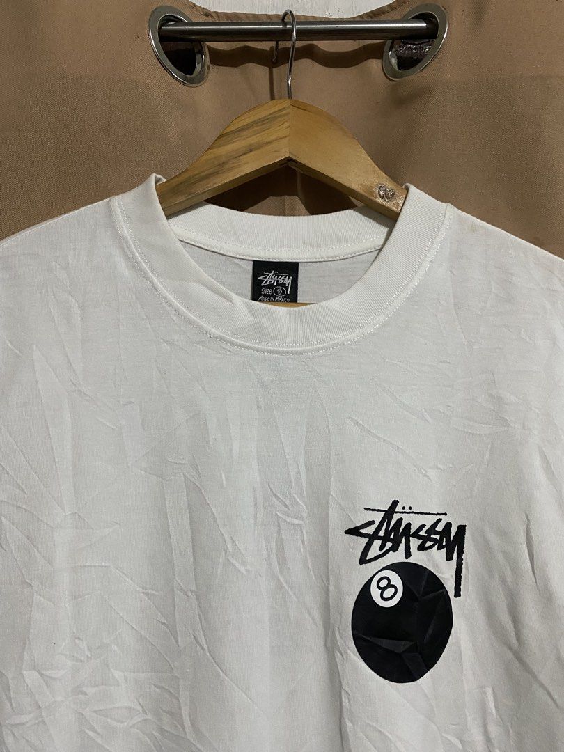 Stussy 8 Ball White Tee (Category: Tshirts & Polo Shirts ) located in Manila. Submitted by why_notph (Listing ID 1468420940, Image 3). Description: - Brand: Stussy - Item: Classic 8-ball graphic t-shirt - Color: White - Size: Small - Material: 100% cotton (Made in Mexico) - Condition: Clean fabric, solid streetwear staple - Care: Machine wash cold - Dimensions: 25x18.