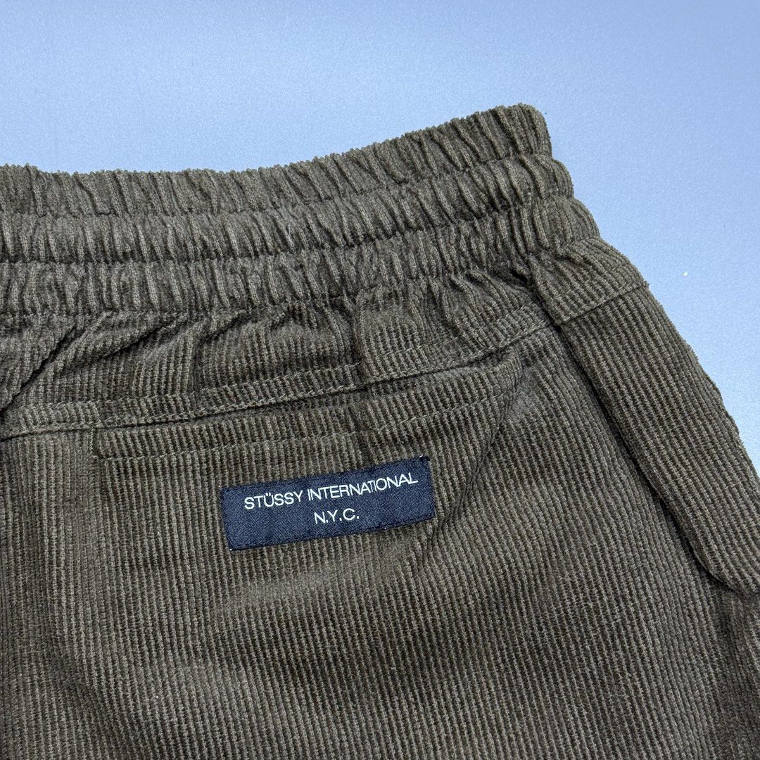Stussy Corduroy (Category: Shorts) located in Kabacan. Submitted by rags2penny.phl (Listing ID 1468332245, Image 3). Description: - Brand: Stussy - Item: Corduroy Shorts - Color: Olive Green - Size: Tagged Size 32 - Fit: Elastic waistband with pull-on design - Details: Embroidered stock logo on hem and woven back pocket label - Condition: Soft textured fabric, perfect for daily casual wear Waistline : 28-32 Length : 17.