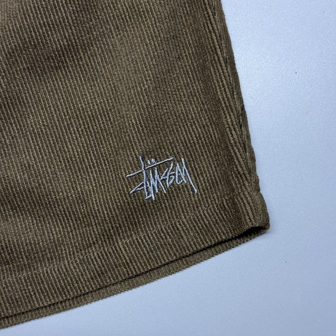Stussy Corduroy (Category: Shorts) located in Kabacan. Submitted by rags2penny.phl (Listing ID 1468332245, Image 2). Description: - Brand: Stussy - Item: Corduroy Shorts - Color: Olive Green - Size: Tagged Size 32 - Fit: Elastic waistband with pull-on design - Details: Embroidered stock logo on hem and woven back pocket label - Condition: Soft textured fabric, perfect for daily casual wear Waistline : 28-32 Length : 17.