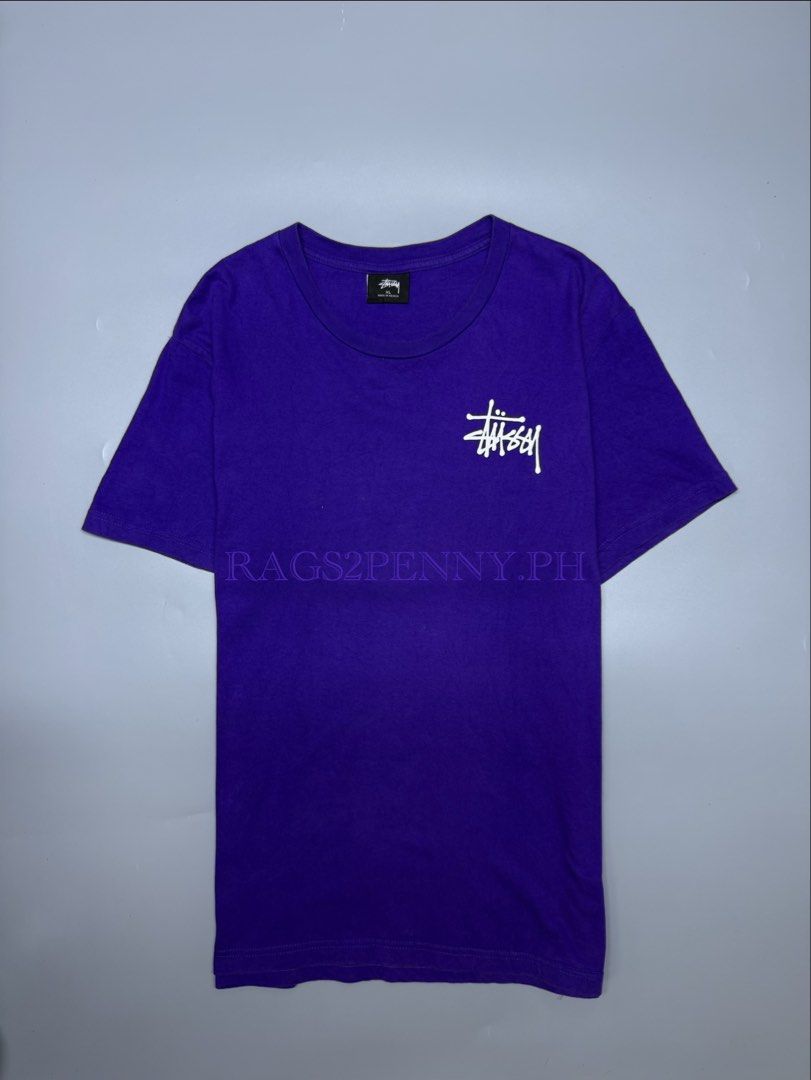 Stussy Purple Tee (Category: Tshirts & Polo Shirts ) located in Kabacan. Submitted by rags2penny.phl (Listing ID 1468339489, Image 1). Description: - Brand: Stussy - Color: Bright Purple - Size: XL - Material: 100% Cotton - Design: Small chest logo, large graffiti back print - Condition: Clean, graphics intact with zero cracking - Origin: Made in Mexico Measurements : 20.5 x 28.