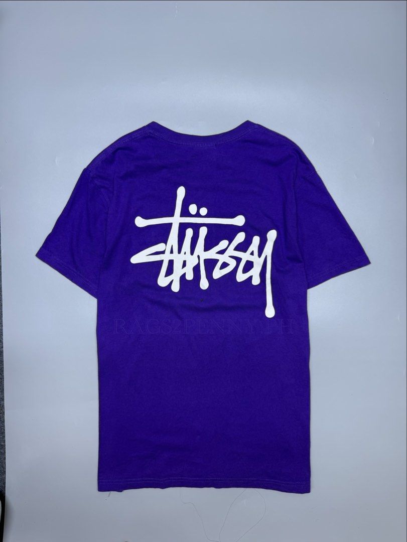 Stussy Purple Tee (Category: Tshirts & Polo Shirts ) located in Kabacan. Submitted by rags2penny.phl (Listing ID 1468339489, Image 2). Description: - Brand: Stussy - Color: Bright Purple - Size: XL - Material: 100% Cotton - Design: Small chest logo, large graffiti back print - Condition: Clean, graphics intact with zero cracking - Origin: Made in Mexico Measurements : 20.5 x 28.
