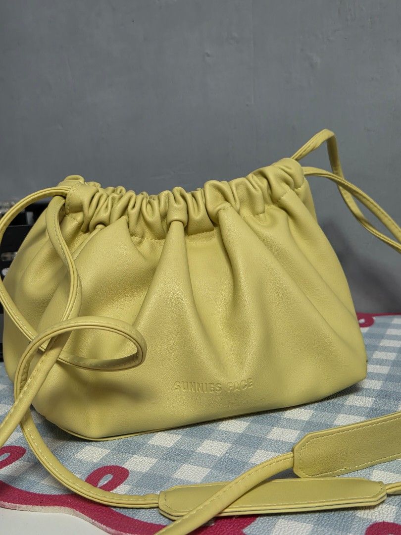 Sunnies Face 2 way dumpling bag in lemon (Category: Cross-body Bags) located in Quezon City. Submitted by clutterthings_ (Listing ID 1468392246, Image 1). Description: as is no major issues no cracks no peeling.