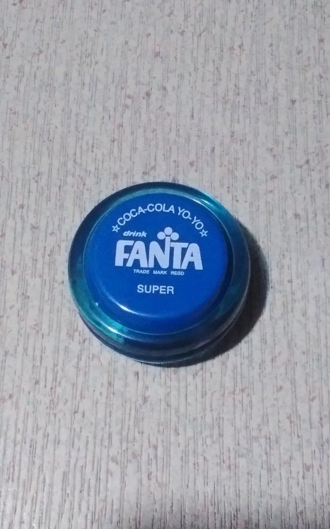 Super fanta yoyo (Category: Announcements) located in Quezon City. Submitted by Bernz (Listing ID 1468370360, Image 1). Description: This item is a vintage-style Fanta "Super" Yo-Yo, specifically a 2006 Limited Edition promotional reissue released by Coca-Cola in Japan. The toy features a translucent blue body with the classic Fanta logo and the words "COCA-COLA YO-YO" and "SUPER" printed on the side. It was produced as a nostalgic tribute to the