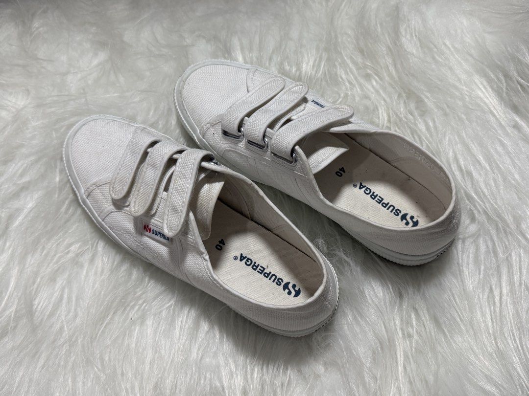 Superga White Sneakers (Category: Sneakers) located in Las Pinas. Submitted by juls_mp (Listing ID 1468382504, Image 2). Description: - Brand: Superga - Style: 2750 Cot3strapu (Low-top canvas sneakers with trendy triple velcro strap closure) - Color: Classic White - Size: 40 EU / 7.5 US Men / 9 US Women / 6.5 UK - Sole: Textured rubber bumper and vulcanized rubber sole for durability - Condition: Brand new with original box and price tag included